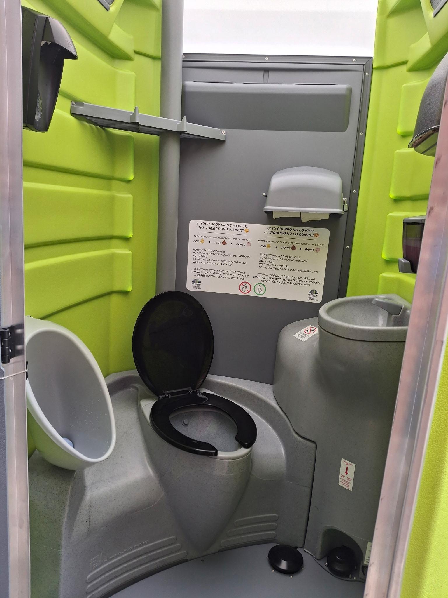 Interior of a Windy City Deluxe PLUS unit with sink and urinal